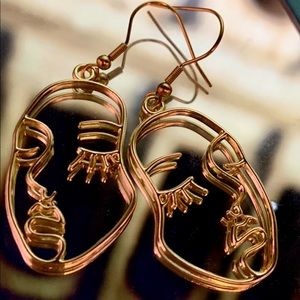 Artsy face dangly earrings